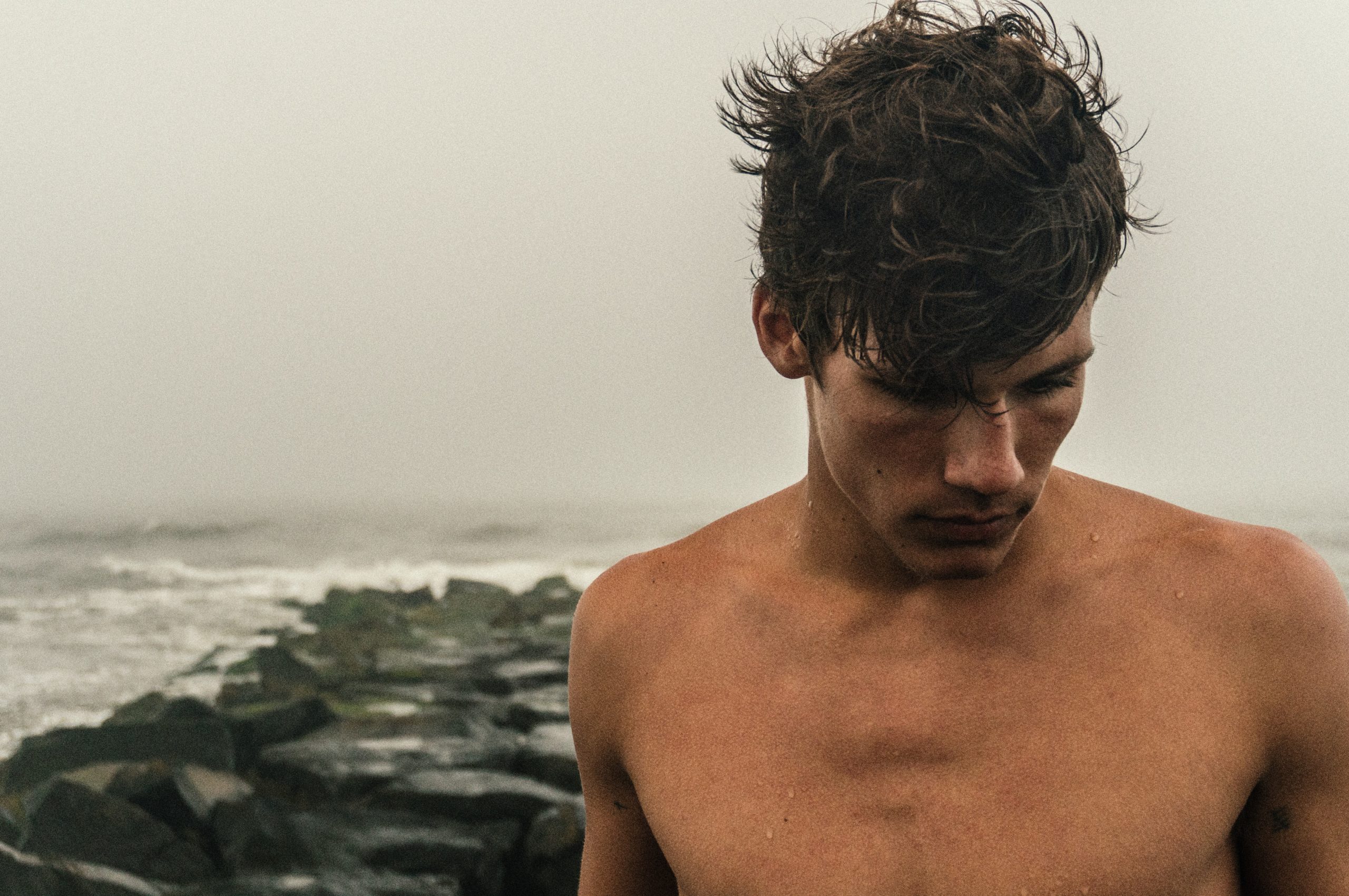 Headshot image of a man at the beach